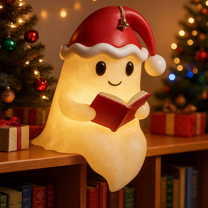 Wit spooklampje met rode kerstmuts en belletje dat een rood boek vasthoudt en warm geel oplicht