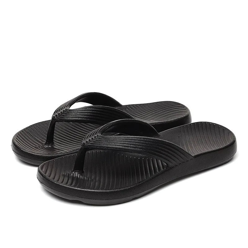 Teenslippers van EVA met dikke zool, geribbelde band en voetbed met schuine ribbels - zwart
