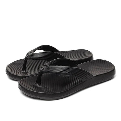 Teenslippers van EVA met dikke zool, geribbelde band en voetbed met schuine ribbels - zwart
