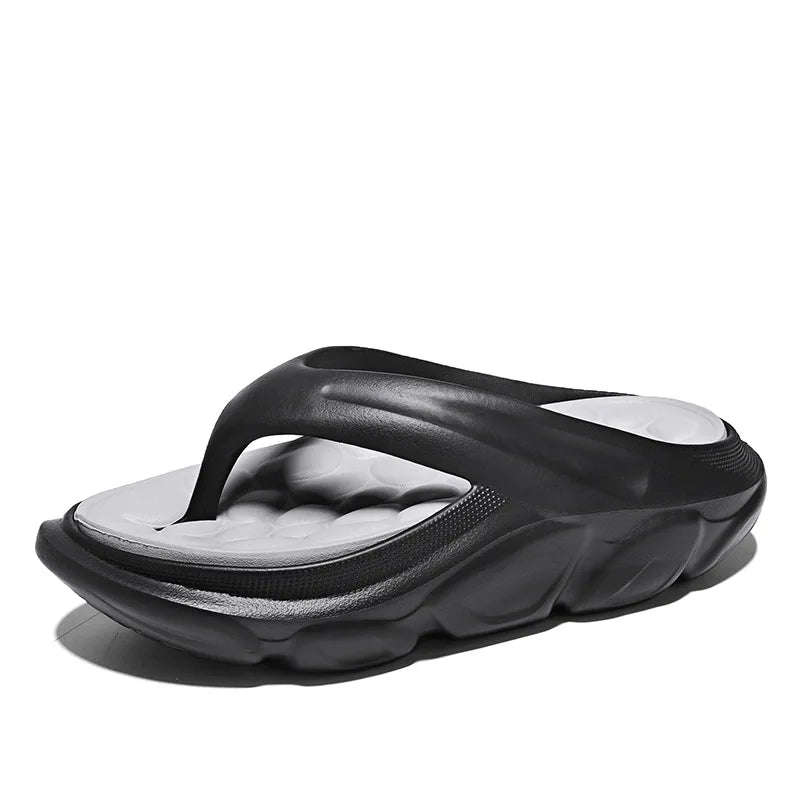 Teenslippers van EVA met dikke zool, voetbed met kiezelvormige noppen en brede band - zwart/grijs