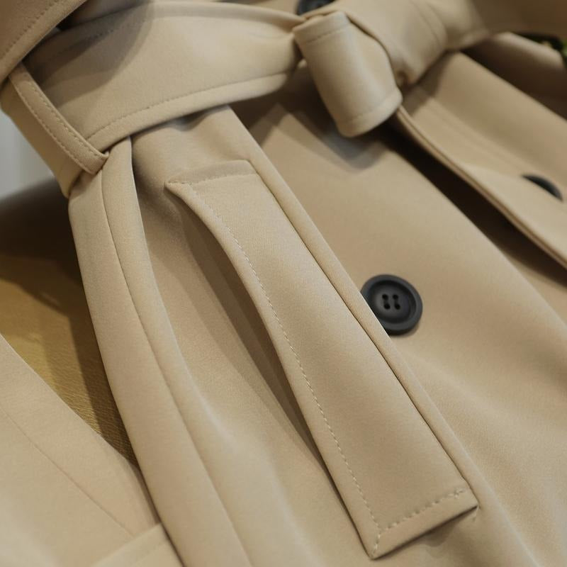 Trenchcoat voor dames met schouderpatten en strikceintuur