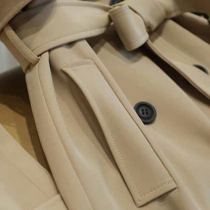 Trenchcoat voor dames met schouderpatten en strikceintuur