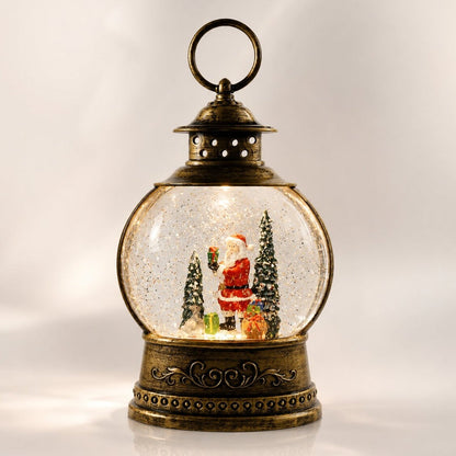 Verlichte sneeuwbollantaarn in antiek brons met kersttafereel - kerstman met cadeaus