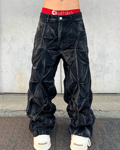 Wijde baggy jeans met geplooide structuur en gewaxte look - beeld 5