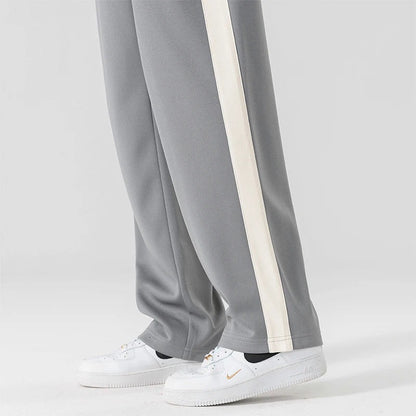 Wijde joggingbroek voor heren met brede contrastband langs de zijnaad en trekkoord - beeld 4