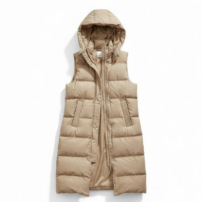 Lange mouwloze damesbodywarmer met gewatteerde capuchon en rits