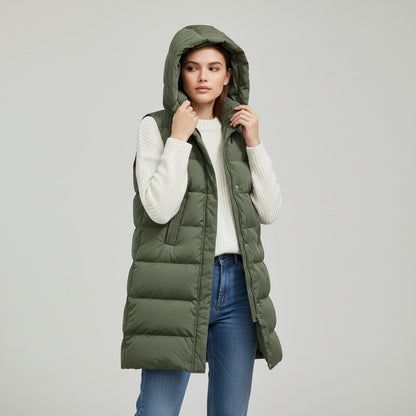 Lange mouwloze damesbodywarmer met gewatteerde capuchon en rits