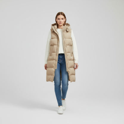 Lange mouwloze damesbodywarmer met gewatteerde capuchon en rits