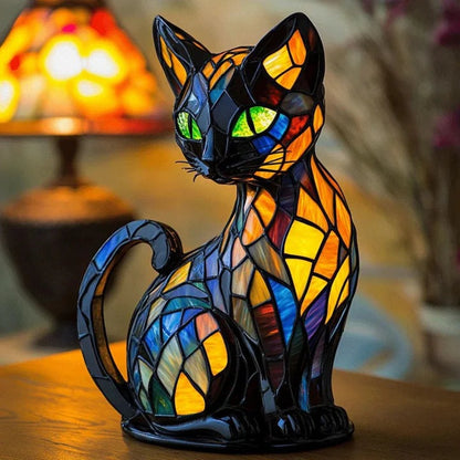 Zwarte kattenlamp in glas-in-loodlook met groene ogen en vlakjes in blauw, oranje en geel